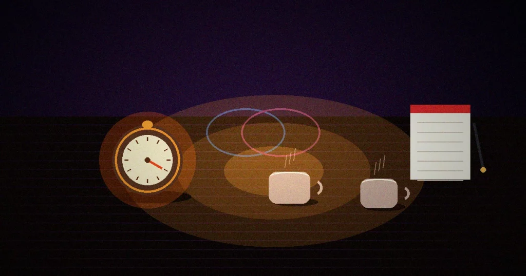 Timer de cozinha, duas chávenas e bloco de notas sobre mesa escura — ritual de conversa emocional a dois
